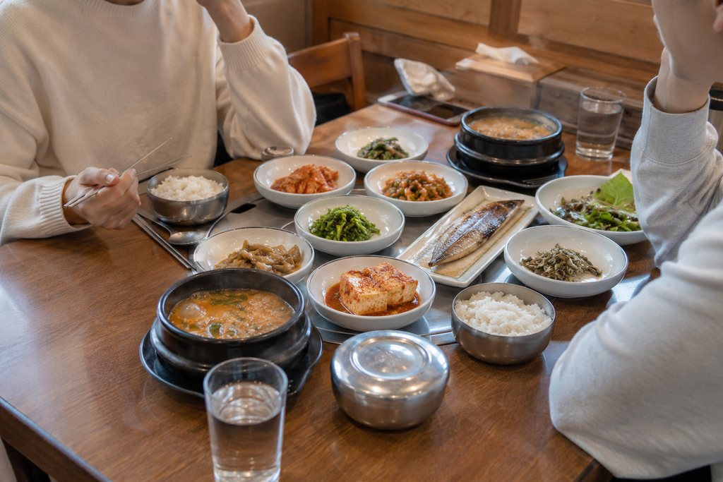 Korean friends talking over a meal