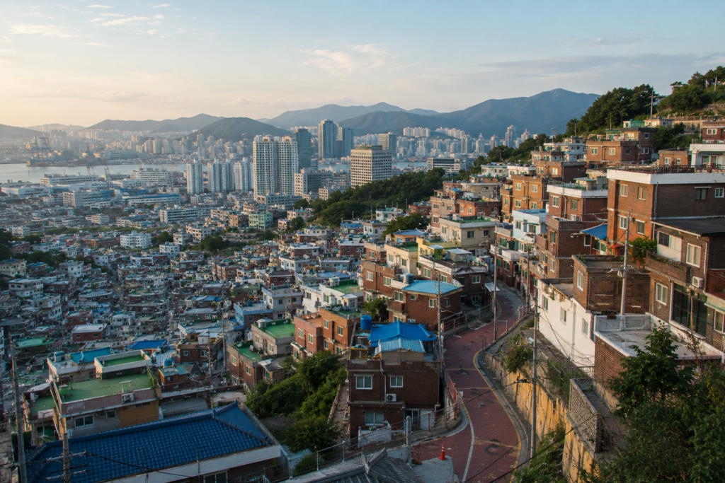 A hillside neighborhood overlooking a dense Korean city